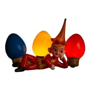 Vintage cheeky rubber crossed leg elf with hat. Christmas MCM Hong Kong